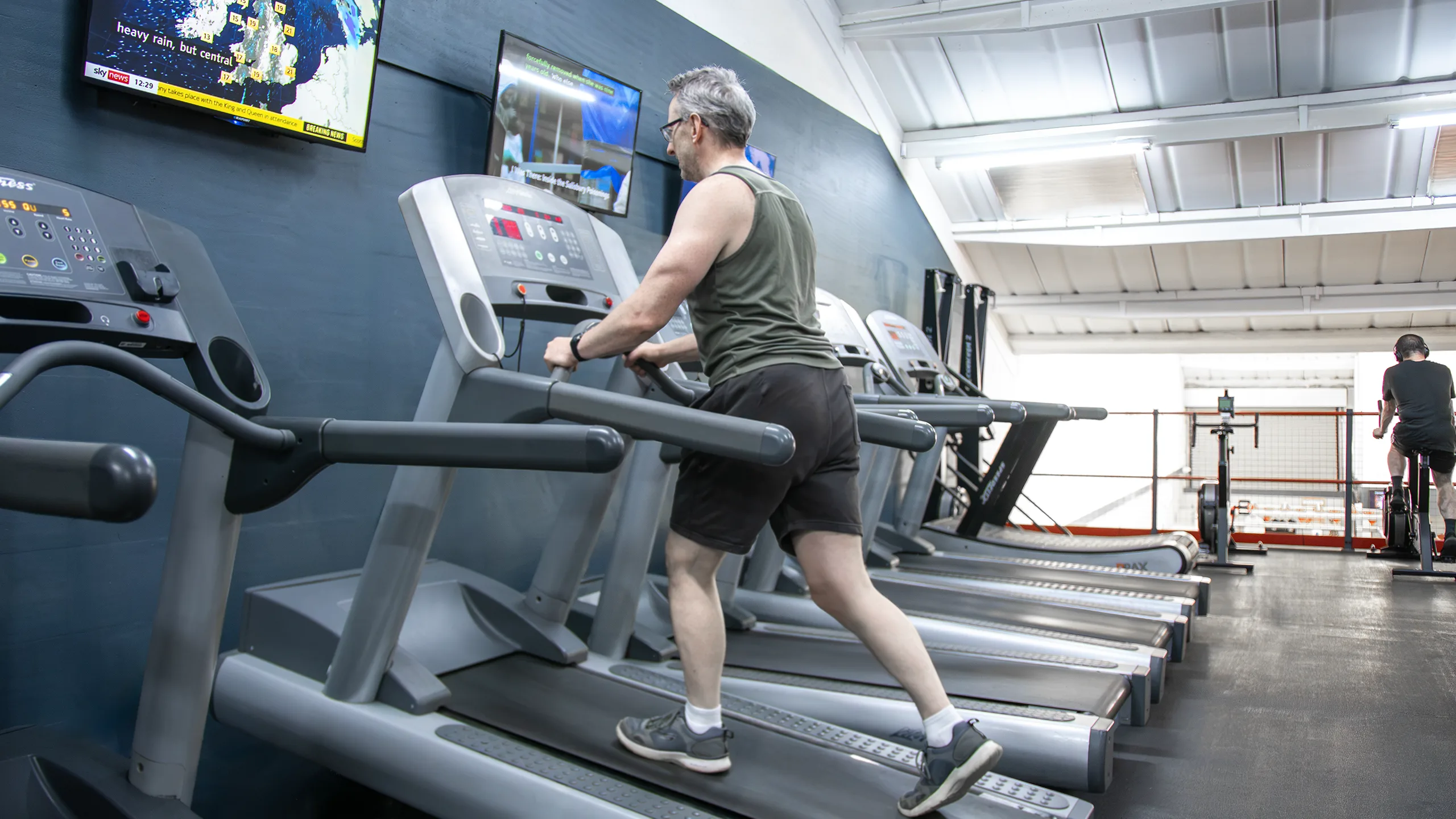 The cardio floor at RP Fitness, a gym in Cambridge with treadmills and assault bikes