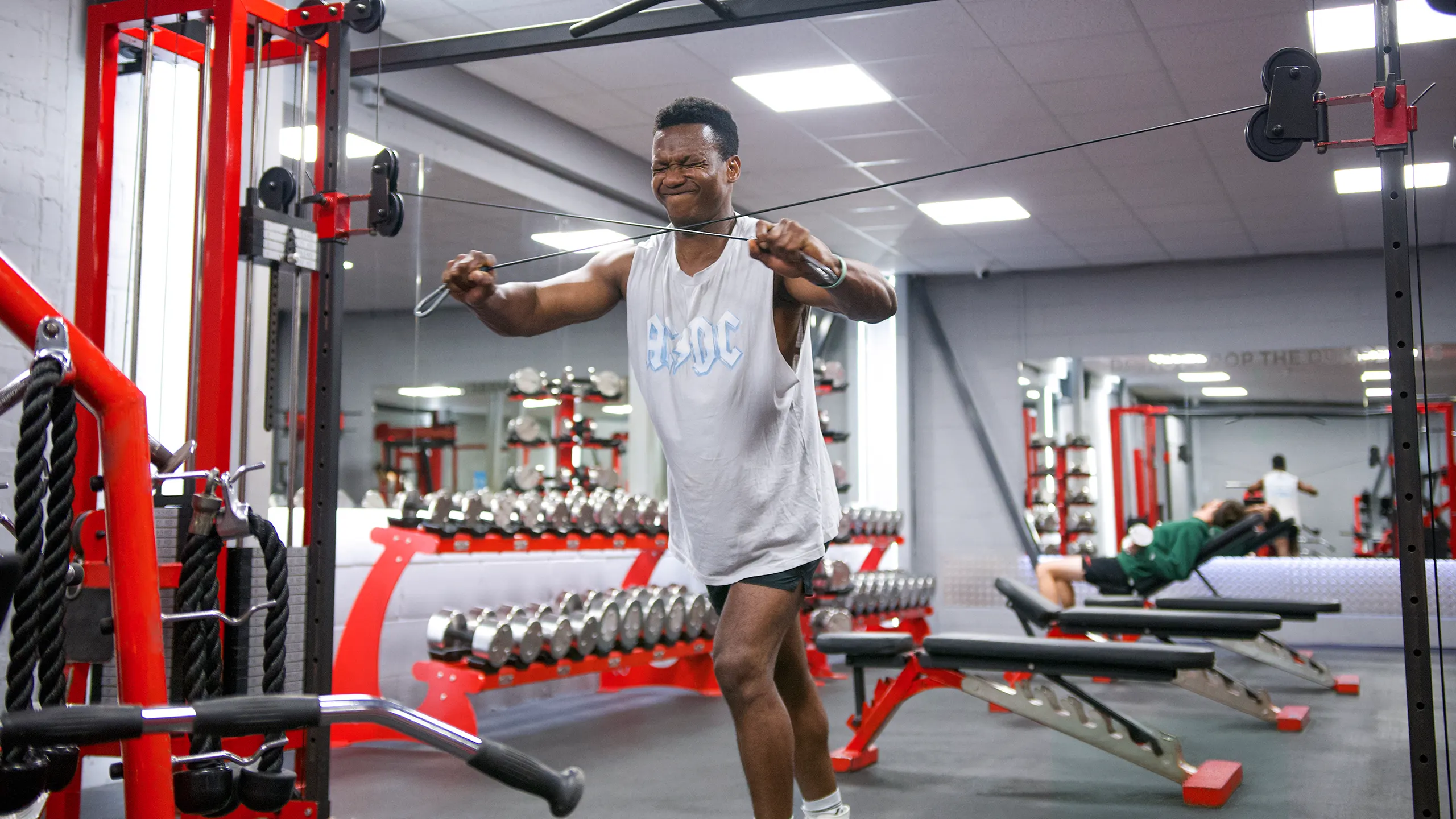 A member using the cable crossover machine at RP Fitness Cambridge