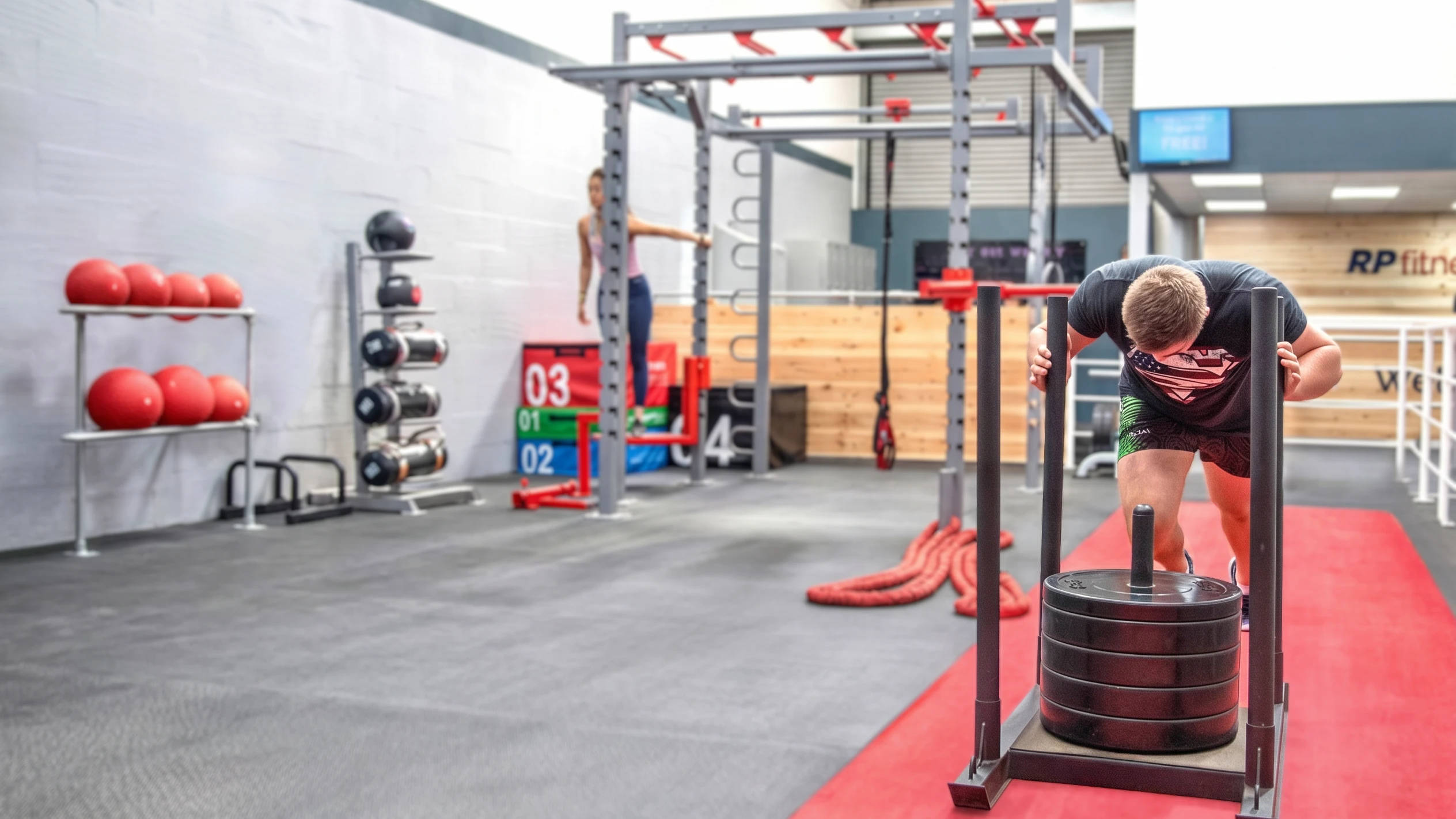 The functional training zone at RP Fitness, with sled track and indoor rig