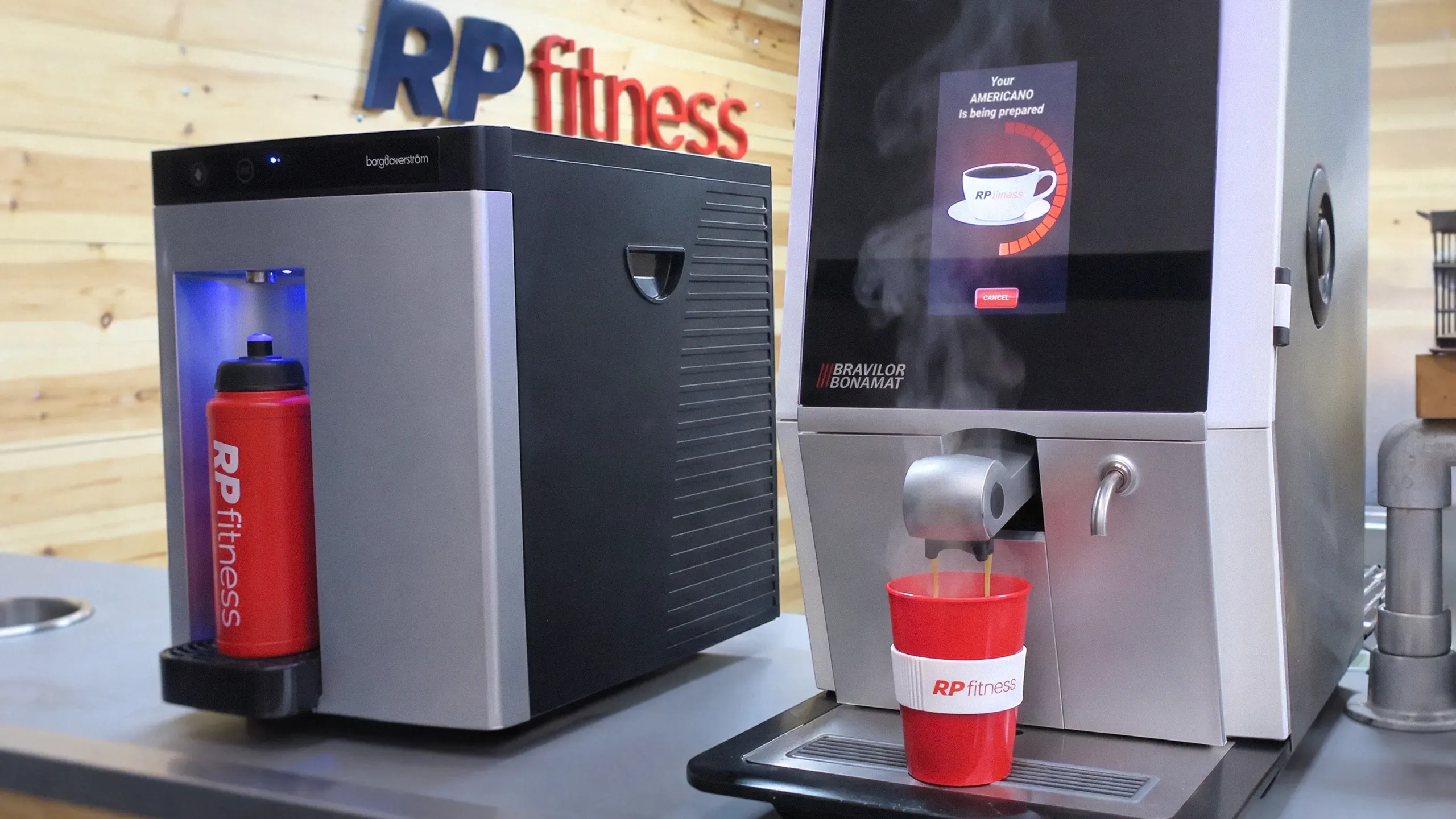 Seating in the RP Fitness cafe beside the coffee machine and water station